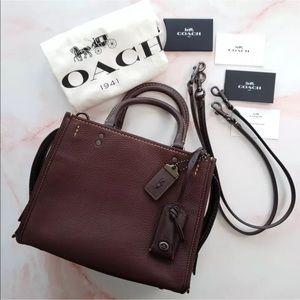 Coach Rogue 25 Oxblood color.
